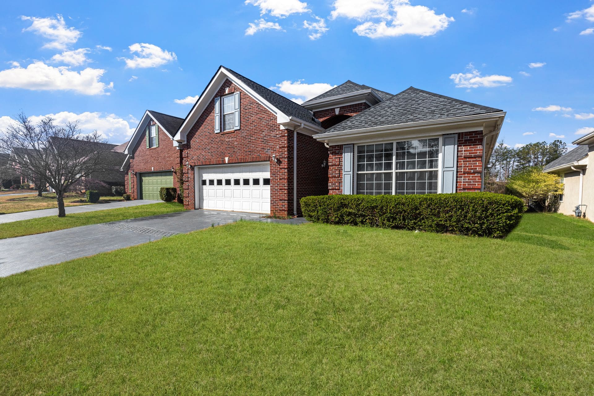 Architectural asphalt shingle roof on a brick home — residential shingle roofing by Carolina Roofing & Steel